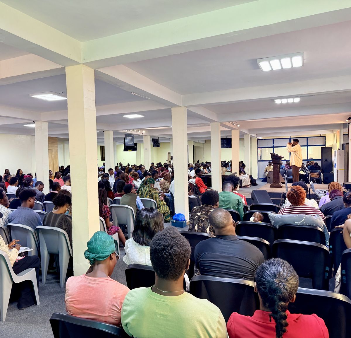 The full church hall during Sunday service, looking toward the pulpit