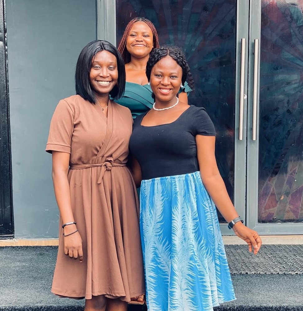 Three women outside This Excellent Church